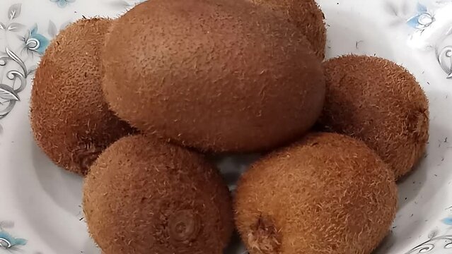 bunch of kiwi fruits on a plate