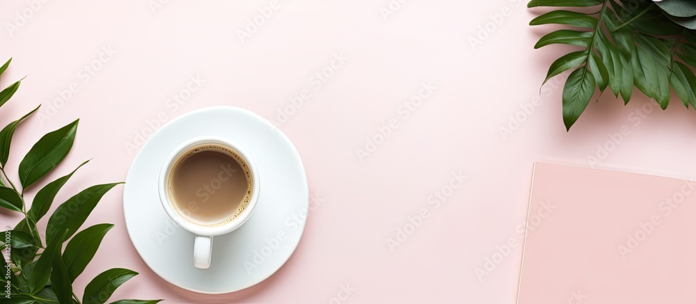 Poster top view of a beautifully arranged workspace desk with a coffee cup and a notebook this feminine and