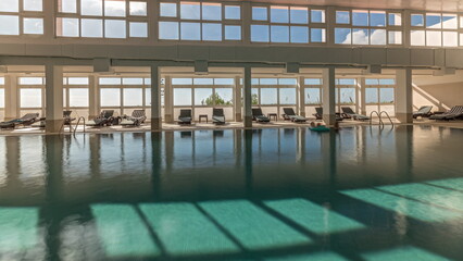 Panorama showing luxury indoor swimming pool, part of hotel timelapse