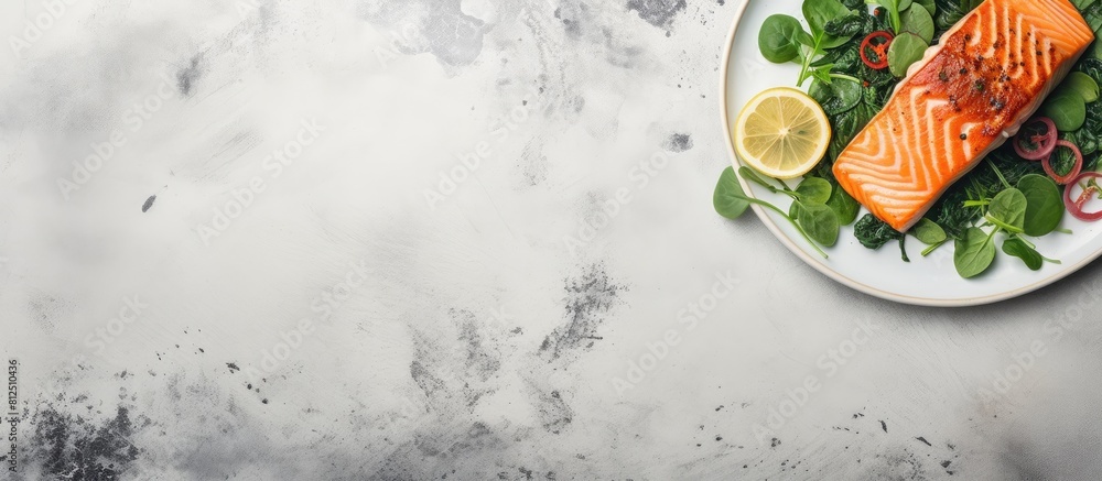 Aufkleber Top view of a grilled salmon dish with a side of spinach perfect for showcasing in a copy space image