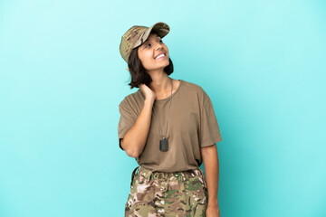 Military mixed race woman with dog tag isolated on blue background thinking an idea