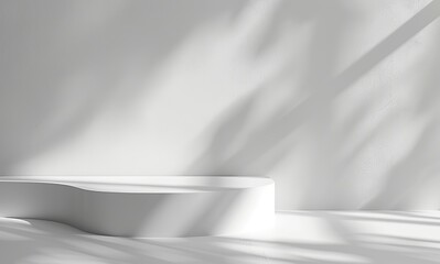 Perfect for illustrating minimalist design, a white pedestal is bathed in shadows and light in a pure white room