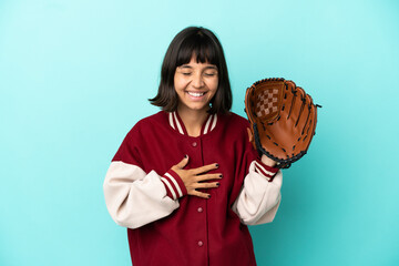 Young mixed race player woman with baseball glove isolated on blue background smiling a lot