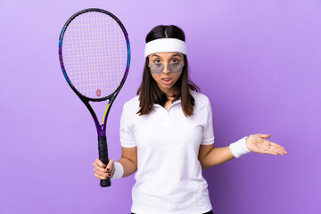 Young woman tennis player over isolated background making doubts gesture