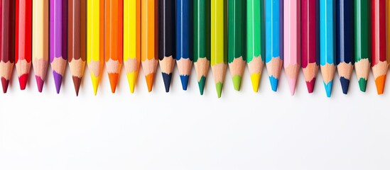 A vibrant array of wax crayons arranged on a white background seen from a captivating perspective with ample space for copying Each crayon is labeled with its respective color name