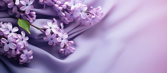 A vibrant bouquet of lilac spring flowers made from purple textiles surrounded by beautiful copy space