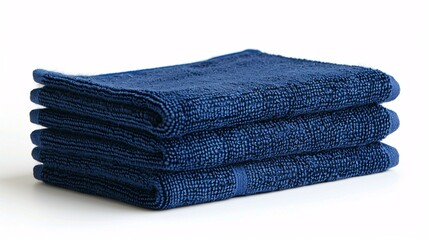 A trio of indigo hair salon towels resting on a blank backdrop.