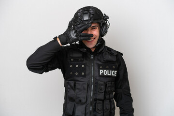 SWAT caucasian man isolated on white background covering eyes by hands and smiling