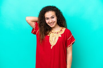 Young Arab woman isolated on blue background laughing