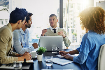 Businessman, laptop and presentation with team in meeting, discussion or development at office. Man...