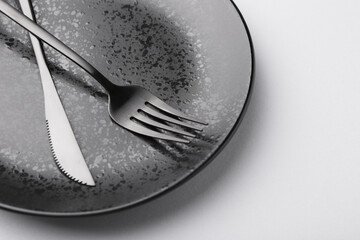 Setting with stylish cutlery on grey table, closeup. Space for text