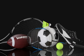 Many different sports equipment on black mirror surface