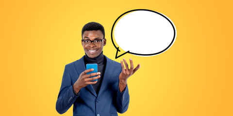 African businessman with smartphone smiling, copy space thought bubble