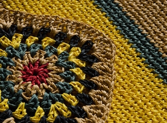 Raffia knitting texture close-up. Hand knitted zigzag jewelry.