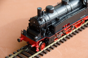 Model of a locomotive on a dark background.