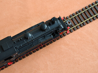 Model of a locomotive on a dark background.