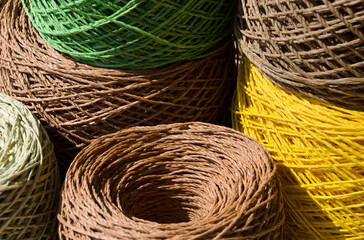 Raffia balls close-up. Skeins of multi-colored raffia are ready for knitting.