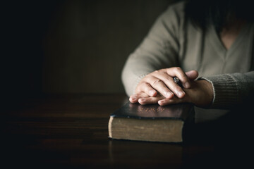 Man with holy bible in his hand, ready to pray, seek guidance from God through religious prayer....