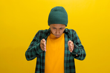 A displeased Asian man, dressed casually in a beanie hat and casual clothes, is gesturing a small size with his finger, indicating something not very big, expressing insecurity and lack of confidence
