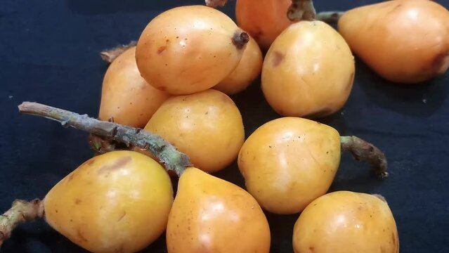 Japanese plums in a slow motion