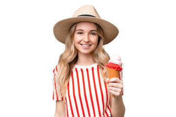 Young English woman with a cornet ice cream over isolated background smiling a lot