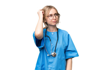 Young nurse English woman over isolated background having doubts and with confuse face expression