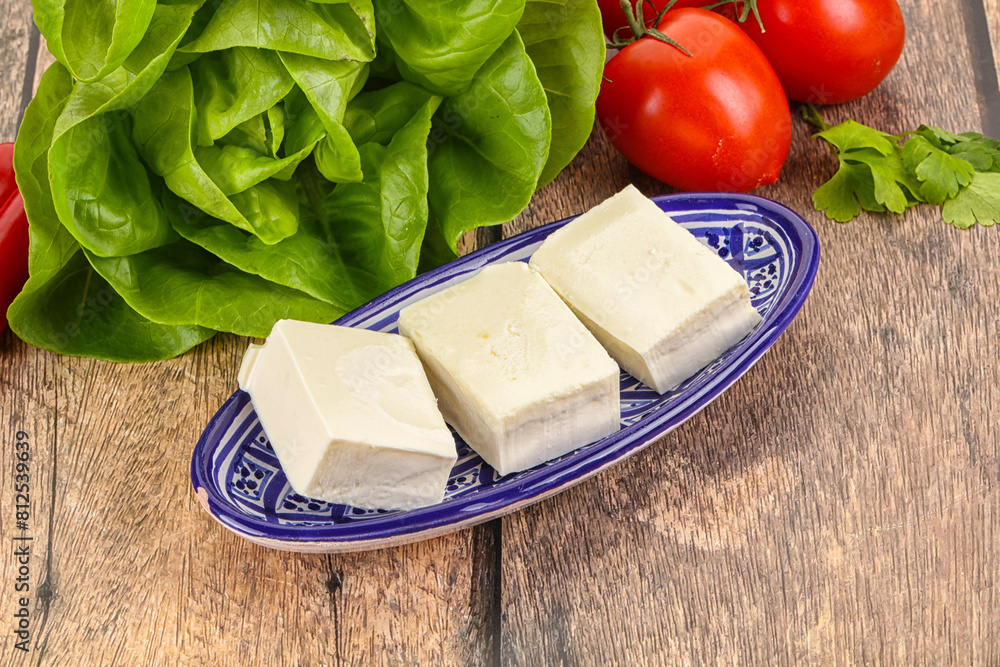 Wall mural Greek traditional Feta cheese in the plate