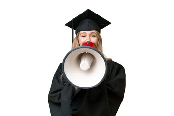 Young university English graduate woman over isolated background shouting through a megaphone