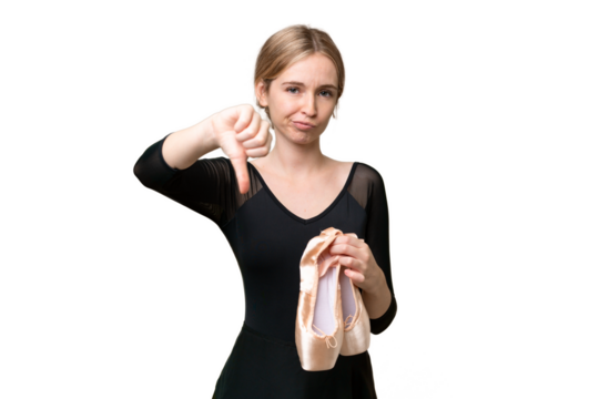 Young English woman practicing ballet over isolated background showing thumb down with negative expression