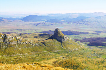 Top view of the Durmitor Ring road, the Stozina peak and the Lake Valley beyond - a beautiful autumn landscape from the Durmitor National Park, Montenegro.