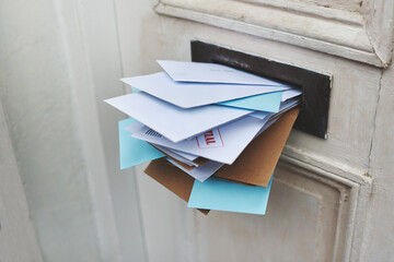 Door, letter and mail or envelope in box of home for communication or notice, stacked and...