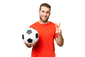Handsome young football player man over isolated chroma key background smiling and showing victory...