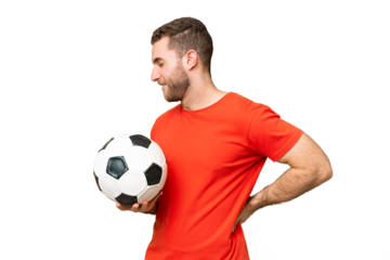 Handsome young football player man over isolated chroma key background suffering from backache for having made an effort