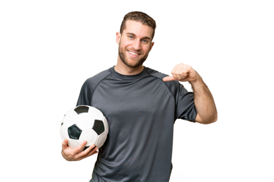 Young handsome blonde man over isolated chroma key background with soccer ball and proud of himself