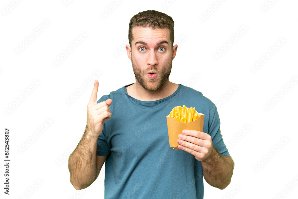 Canvas Prints Young handsome blonde man holding fried chips over isolated chroma key background intending to realizes the solution while lifting a finger up