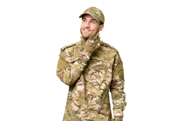 Military man over isolated chroma key background thinking an idea while looking up