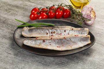 Marinated herring fillet with green onion