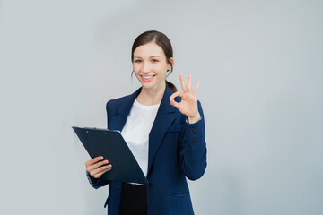 Happy young businesswoman presenting or pointing, happy working.
