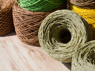 Raffia balls close-up. Skeins of multi-colored raffia are ready for knitting.