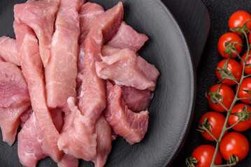 Slices of raw pork or turkey meat with salt, spices and herbs