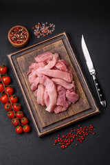 Slices of raw pork or turkey meat with salt, spices and herbs