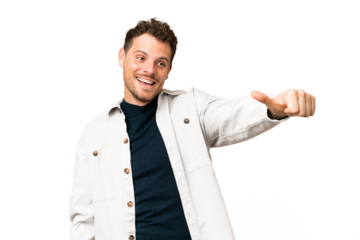 Brazilian man over isolated chroma key background giving a thumbs up gesture