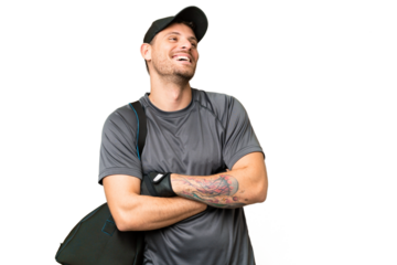 Young sport man with sport bag over isolated chroma key background happy and smiling