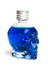 Blue posion liquid in the skull shape bottle isolated on the white background. Front view. Danger water.
