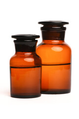 Brown bottle with the liquid isolated on the white background. Front view.