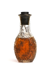 Brown bottle with the liquid isolated on the white background. Front view.
