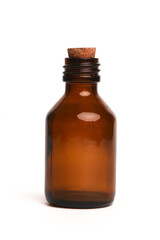 Brown bottle with the liquid isolated on the white background. Front view.