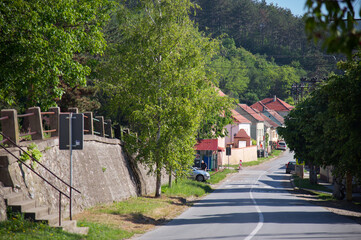 Typical rural landscape in Serbia. Green landscape with road and houses on a sunny day