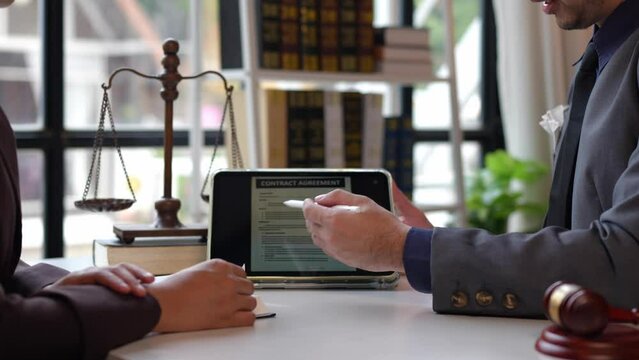 Lawyers provide legal advice and chat with clients via online tablets to clarify and give advice on the rules in contract documents that must be followed at the company correctly and fairly.