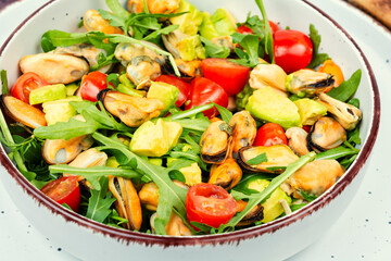Salad with mussels, herbs and vegetables.